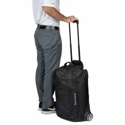 TaylorMade Performance Golf Rolling Carry On Bag -Golf Clubs Shop taylormade 2020 performance rolling carry on bag person holding